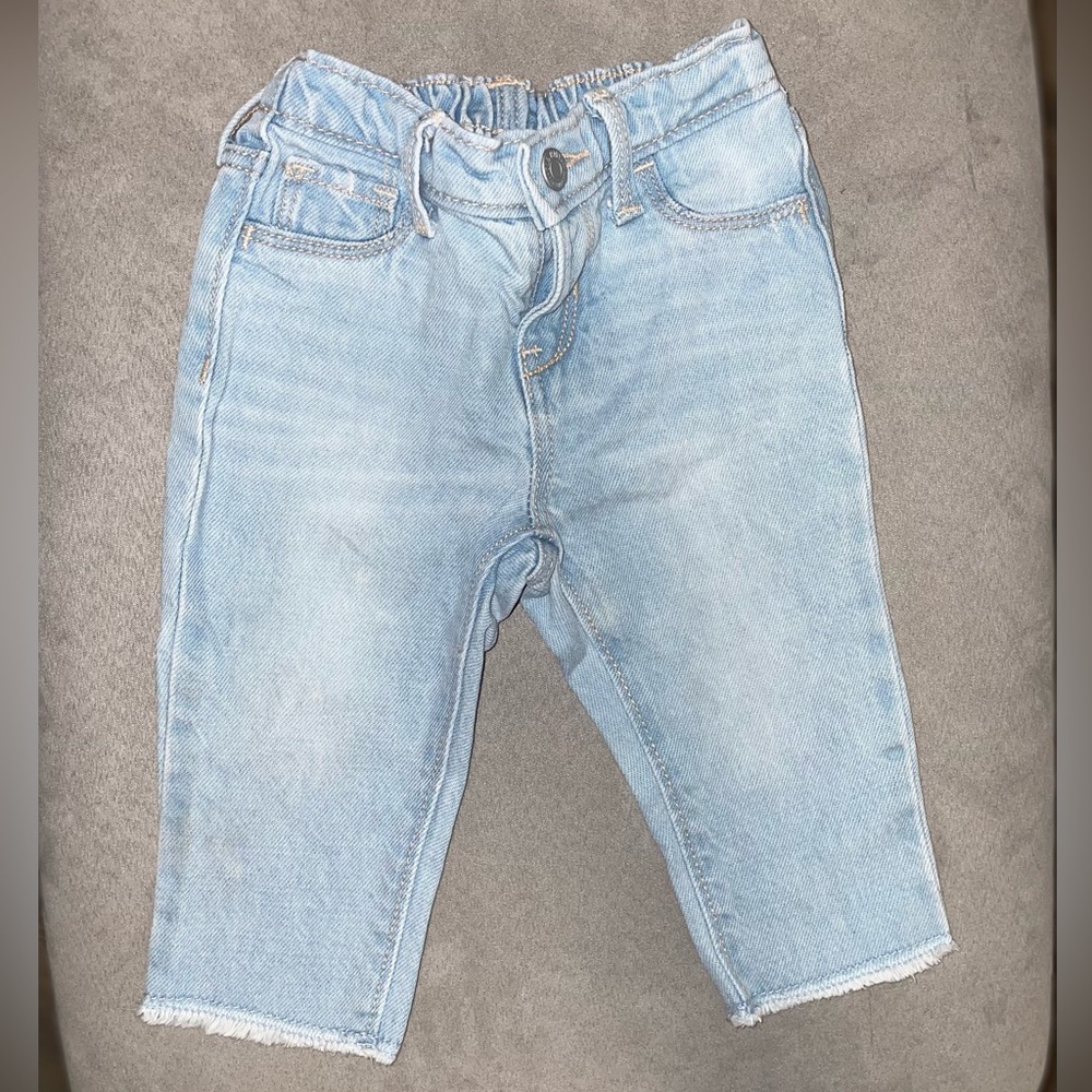 Light blue baby girl jeans either fringe bottom